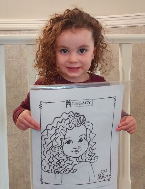 Cute curly haired girl with her caricature.