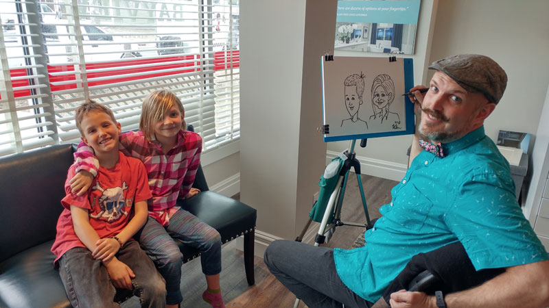 Picture of Rob Drawing Kids at an event.